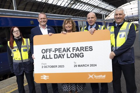 At Glasgow Queen Street station, five ScotRail staff display a huge promotional off-peak all-day ticket. From the right, they are: Scott Smith, ScotRail Customer Service Assistant; Ian Gray, ScotRail Welcome Host; Fiona Hyslop MSP, Minister for Transport; Alex Hynes, Scotland's Railway Managing Director; and Nicola Murray, ScotRail Customer Service Assistant - who is the only one not smiling.