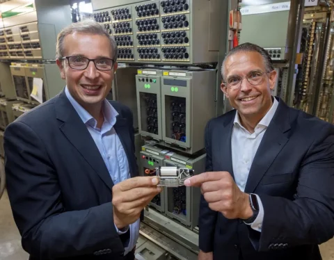 Head of Rail Infrastructure Germany at Siemens Mobility Guido Rumpel and Michael Feller, CEO of Ruhrbahn, pose in one of the five relay interlockings to be modernised.