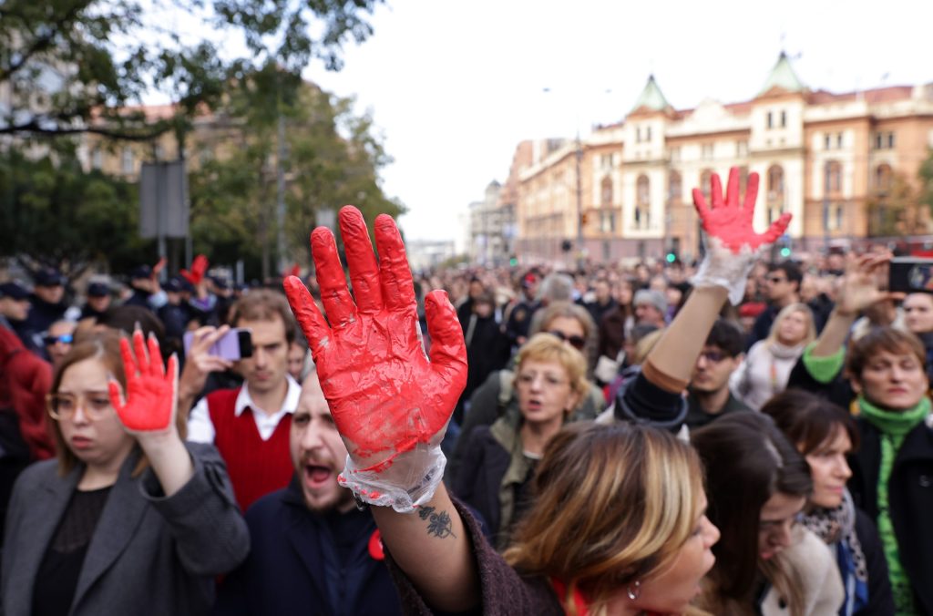 A protester with her hand painted red attends a protest to support the victims of the collapse of the canopy at Novi Sad railway station.