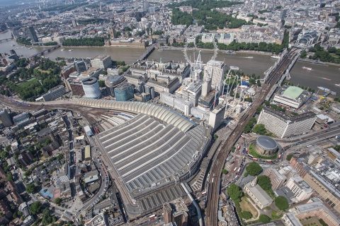 Aerial picture of London Waterloo station with the Palace of Westminster, the seat of government on the opposite bank of the Thames